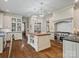 Bright kitchen with a wooden island, stainless steel appliances, and custom cabinetry at 7906 Skye Lochs Dr, Waxhaw, NC 28173