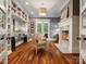 Comfortable living room with fireplace, built-in bookshelves, and French doors leading to the outdoor space at 7906 Skye Lochs Dr, Waxhaw, NC 28173