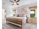 Comfortable main bedroom featuring a large bed, world map, neutral colors, and natural light from two windows at 7906 Skye Lochs Dr, Waxhaw, NC 28173