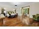 Bright and spacious main bedroom features large windows and a sitting area, perfect for relaxation at 7906 Skye Lochs Dr, Waxhaw, NC 28173