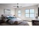Serene bedroom with a large window, ceiling fan, neutral color scheme, and contemporary furnishings at 808 Garringer Pl, Charlotte, NC 28208