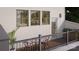 A cozy balcony features a small table and chairs, perfect for relaxing outdoors with a view from a second level at 817 Garringer Pl, Charlotte, NC 28208