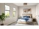 Bright bedroom featuring large windows, neutral decor, and comfortable bedding for a restful retreat at 817 Garringer Pl, Charlotte, NC 28208