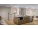 Bright kitchen island with stainless appliances, offering eat-in seating, and seamlessly connects to dining at 817 Garringer Pl, Charlotte, NC 28208