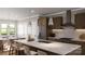 Modern kitchen with stainless steel appliances, granite countertops, breakfast bar, and stylish pendant lighting at 817 Garringer Pl, Charlotte, NC 28208