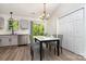 Eat-in kitchen dining area next to stainless steel dishwasher and backyard sliding glass door at 8809 Reedy Creek Rd, Charlotte, NC 28215