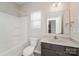 Bathroom with a vanity, shower, toilet, and natural light from the window at 9127 Colwick Hill Ln, Charlotte, NC 28215