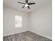 Bedroom with hard surface floors, ceiling fan, and natural light from the window at 9127 Colwick Hill Ln, Charlotte, NC 28215
