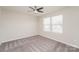 Bedroom with carpet floors, a ceiling fan, and natural light from the large windows at 9127 Colwick Hill Ln, Charlotte, NC 28215
