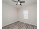 Bedroom featuring stylish hard surface floors, ceiling fan, and ample natural light at 9127 Colwick Hill Ln, Charlotte, NC 28215