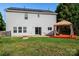 Spacious backyard featuring a gazebo, fire pit, and sliding glass doors at 9414 Seamill Rd, Charlotte, NC 28278