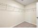 Walk-in closet with built-in metal shelving for optimal storage and organization at 9414 Seamill Rd, Charlotte, NC 28278