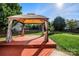 Relaxing gazebo with wood flooring and curtains at 9414 Seamill Rd, Charlotte, NC 28278