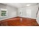 Bright living room with gleaming hardwood floors, neutral walls, and plenty of natural light at 9414 Seamill Rd, Charlotte, NC 28278