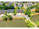 Beautiful aerial view of townhomes with pond views and mature trees surrounding the property at 1006 Phil Oneil Dr, Charlotte, NC 28215