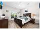 Comfortable bedroom with a ceiling fan and a large window providing natural light at 1006 Phil Oneil Dr, Charlotte, NC 28215
