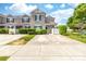 Charming two-story townhome with well-maintained landscaping, front yard and private parking at 1006 Phil Oneil Dr, Charlotte, NC 28215