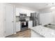 Modern kitchen with stainless steel appliances, granite countertops, and ample cabinet space at 1006 Phil Oneil Dr, Charlotte, NC 28215