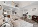 Open-concept living room featuring high ceilings and hardwood floors and view to loft area at 1006 Phil Oneil Dr, Charlotte, NC 28215