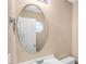 Bathroom featuring vanity, faucet, a toilet, a round mirror, and neutral wall color at 10330 Seedling Ln, Charlotte, NC 28214