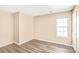 Bedroom with a large window and neutral walls at 10330 Seedling Ln, Charlotte, NC 28214