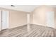 Well-lit bedroom with multiple doors and neutral walls at 10330 Seedling Ln, Charlotte, NC 28214