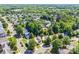 An expansive aerial view showcases a vibrant residential community surrounded by lush greenery at 10330 Seedling Ln, Charlotte, NC 28214