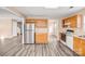 Well-lit kitchen with stainless steel refrigerator and modern appliances at 10330 Seedling Ln, Charlotte, NC 28214