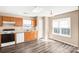 Bright kitchen features wood cabinets, modern appliances, and ample counter space at 10330 Seedling Ln, Charlotte, NC 28214