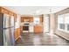 Bright kitchen features stainless steel appliances, wood cabinets, and ample counter space at 10330 Seedling Ln, Charlotte, NC 28214