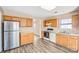 Bright kitchen features wood cabinets, modern appliances, and ample counter space at 10330 Seedling Ln, Charlotte, NC 28214