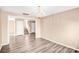 Spacious living room with hardwood floors, modern lighting, and an open floor plan at 10330 Seedling Ln, Charlotte, NC 28214