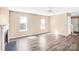 Open living room featuring a fireplace, new flooring, and lots of natural light at 10330 Seedling Ln, Charlotte, NC 28214