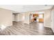 Open living space featuring new floors connecting the living room to the kitchen at 10330 Seedling Ln, Charlotte, NC 28214