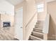 Staircase with wooden steps and white banister leading to the upper level at 10330 Seedling Ln, Charlotte, NC 28214