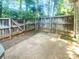Fenced backyard with a stone patio, providing privacy and space for outdoor enjoyment at 1043 Park West Dr, Charlotte, NC 28209