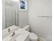 Clean bathroom featuring double sinks and a glass-enclosed shower at 1043 Park West Dr, Charlotte, NC 28209