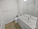 Cozy bathroom with white vanity, a large mirror, and tile floors at 1043 Park West Dr, Charlotte, NC 28209