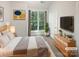 Comfortable bedroom with a large window providing ample natural light and a cozy atmosphere at 1043 Park West Dr, Charlotte, NC 28209