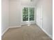 Bright bedroom with a large window providing ample natural light at 1043 Park West Dr, Charlotte, NC 28209