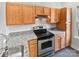 Functional kitchen with stainless steel appliances and granite countertops at 1043 Park West Dr, Charlotte, NC 28209
