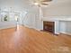 Spacious living room featuring a fireplace and beautiful hardwood floors at 1043 Park West Dr, Charlotte, NC 28209