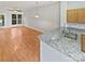 Bright living room featuring a ceiling fan and glass door providing ample natural light at 1043 Park West Dr, Charlotte, NC 28209