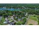 Aerial view highlights a lakefront community with tree lined streets at 106 Chatworth Ln, Mooresville, NC 28117