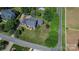 Aerial view showcases home with mature trees and spacious yard at 106 Chatworth Ln, Mooresville, NC 28117