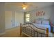 Bedroom features carpet, light blue walls, two closets, and natural light from the window at 106 Chatworth Ln, Mooresville, NC 28117