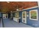 Spacious covered patio with ceiling fans and plenty of room for outdoor entertaining at 106 Chatworth Ln, Mooresville, NC 28117