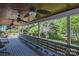 Spacious covered porch with ceiling fans and backyard views offers ample seating at 106 Chatworth Ln, Mooresville, NC 28117