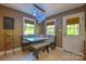 Cozy breakfast nook with a cushioned bench, pendant lighting, and a view to the backyard at 106 Chatworth Ln, Mooresville, NC 28117