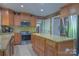 This kitchen has stainless steel appliances, tile backsplash, and a granite-topped island at 106 Chatworth Ln, Mooresville, NC 28117